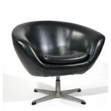 MID CENTURY LOUNGE ARMCHAIR | Black leatherette/ vinyl covering, single cushion on a swiveling cast 