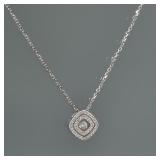 DIAMOND PENDANT NECKLACE | A single diamond nested inside two diamond-encrusted squares, on a chain.
