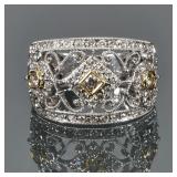 DIAMOND & 18K GOLD FILIGREE RING | Designed as three .15ct diamonds set in yellow gold bezels among 