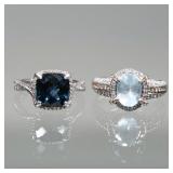 (2pc) FACETED BLUE STONE & 14K GOLD RINGS | Including a ring with central oval modified cut aquamari