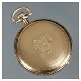 WALTHAM 14K GOLD POCKET WATCH | In an engine turned and monogrammed gold case, having Arabic numeral