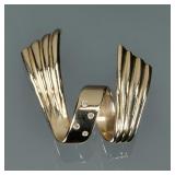 DIAMOND & 14K GOLD SPIRAL MOUNTING | Four melee diamonds set in a 14k yellow gold spiral ribbon-form