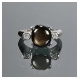 BLACK QUARTZ CABOCHON, DIAMOND & 14K GOLD RING | Designed as a central phenomenal black quartz (11 x