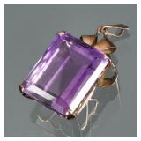 A LARGE RECTANGULAR CUT AMETHYST & 14K GOLD PENDANT | Designed as a central rectangular mixed cut, a