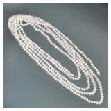 VERY LONG STRANDS OF BAROQUE PEARLS | Designed as a very long knotted strand of (approx. 6.5mm) baro