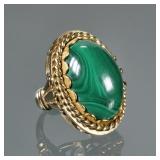 MALACHITE CABOCHON & 14K GOLD RING | Designed as a central solid polished oval malachite (20.5 x 15 