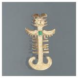 18K EMERALD FIGURAL PIN | Designed as a pierced textured gold figural pin with Mayan or Aztec figure