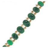 CARVED SPINACH JADE & 14K GOLD BRACELET | Designed as 8 links of oval shell-pattern carved jade plaq