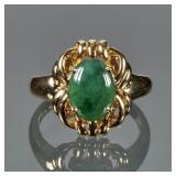 JADEITE CABOCHON & 18K GOLD RING | Designed as a central jade cabochon (10 x 7.4 in.) With gold back