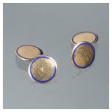 PAIR BLUE ENAMEL & 14K GOLD CUFFLINKS | Designed as polish round gold cufflinks each set with a bord