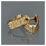 PAIR DIAMOND & 18K GOLD CUFFLINKS | Designed as woven 18k white and yellow god mounting two small me
