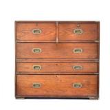 ANTIQUE ENGLISH CAMPAIGN CHEST | In two sections, two drawers (one a fall-front desk) over three ful