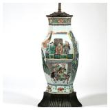 A CHINESE FAMILLE VERTE HEXAGONAL LAMP | Hexagonal baluster form vase mounted as a lamp; 15.5 in. (c