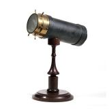 CHARLES G. BUSH KALEIDOSCOPE | An American C. G. Bush & Co. tabletop kaleidoscope mounted on a wood 