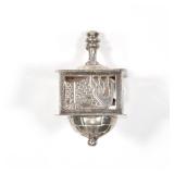 STERLING SILVER DREIDEL | A silver dreidel with openwork sides marked "Israel st 925"; 1.75 in., 0.7