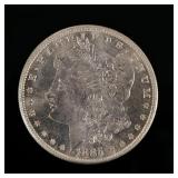 1885-P MORGAN SILVER DOLLAR | Enclosed with a piece of paper describing it as "borderline MS65"