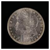 1882-P MORGAN SILVER DOLLAR | In an envelope listing it as "borderline MS 65".