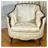 ANTIQUE CURVED ARMCHAIR | Antique Victorian armchair with curved and tufted back & arms over carved 