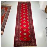 RED GEOMETRIC RUNNER | Having red backing with geometric medallions and border. - w. 36 x l. 124 in