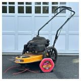 CUB CADET ST 100 WHEELED STRING TRIMMER | Cub Cadet ST 100 gas-powered 22” wheeled string trimmer wi