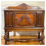 ANTIQUE CARVED WOOD BUFFET | Having carved backboard over relief carved cabinet with large door with