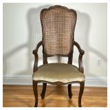 CANED BACK ARMCHAIR | Having carved caned back over cabriole legs. - h. 45 x w. 19.5 x l. 22 in