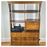 WOOD SHELVING UNIT | Having 6 split-width shelves with fold down cabinet over 2-door central cabinet
