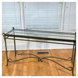 METAL & GLASS SIDE TABLE | Having beveled glass top over x-stretcher. - h. 30 x w. 18 x l. 57 in