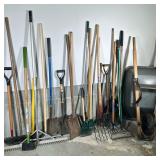 LARGE LOT YARD TOOLS | Including: wheelbarrow, pitchforks, spade, shovels, rakes, hoe, pick and more