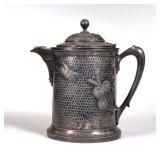 LARGE HAMMERED MERIDEN SILVERPLATE TANKARD | Hammered with applied decorations of swans and flowers.