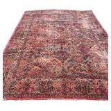 KARASTAN WOOL CARPET | Having an overall pattern on a red ground. - w. 12