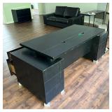 BLACK EXECUTIVE’S DESK | Black wood with tiered design, two banks of drawers and a keyboard slideout