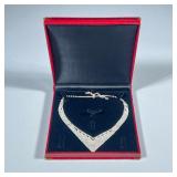 DIAMOND SIMULANT NECKLACE | Designed as a curved v-shape diamond simulant necklace, in a red alligat