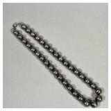 STERLING BEADED NECKLACE | Sterling silver beaded necklace on a silver chain, marked 925 on the clas