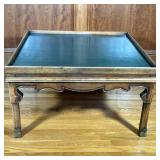 LEATHER TOP COFFEE TABLE | Green leather top with embossed gilt border and carved legs. - h. 19.25 x