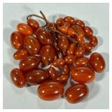 Loose Amber Beads | Of varying sizes, for jewelry making. - l. 1 in (largest, approx.)