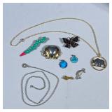 MIXED COSTUME JEWELRY | Including gold tone necklace with bear pendant, elephant pin, butterfly pin,