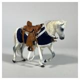 MINIATURE SADDLE & HORSE FIGURINE | White horse figurine with blue coat and a detailed tooled leathe
