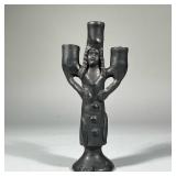 FIGURAL POTTERY CANDLESTICK | An unusual figural pottery candle stick holder of modern style designe
