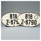 (2pc) VINTAGE LICENSE PLATES | Two vintage German license plates of oval shape with black pressed le