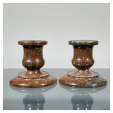 PAIR STONE CANDLESTICKS | Carved/turned candlesticks in a deep red variegated marble or other stone.