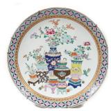 MONUMENTAL CHINESE FAMILLE ROSE CHARGER | Showing various bouquets in vases with colorful gilt rim. 