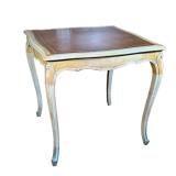 FRENCH LOUIS XV STYLE GAMES TABLE | Leather inset top with embossed gilt border and carved carbriole