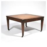 LEATHER TOP LOW TABLE | Coffee table having an inset leather top with gilt border and carved flower 