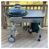 WEBER PERFORMER CHARCOAL GRILL | Round Weber charcoal grill with built-in propane ignition, metal to