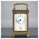 FRENCH BRASS CARRIAGE CLOCK | Brass case with beveled glass, face with Roman numeral markers and sub