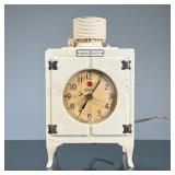 GENERAL ELECTRIC CLOCK | GE heavy cast metal refrigerator-form clock, electric. - h. 8.5 x l. 5 x d.