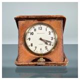 WALTHAM TRAVEL CLOCK | Waltham 8 day clock in a large pocket watch form set in a folding leather tra