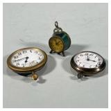 (3pc) MISC. SMALL CLOCKS | Including a miniature green alarm clock, a Swiss 8 day clock, and a Kenzi