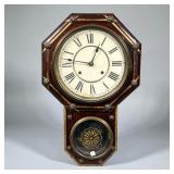 GRAIN-PAINTED OCTAGONAL WALL CLOCK | Octagonal face with Roman numeral markers. - h. 21.5 x w. 13.5 